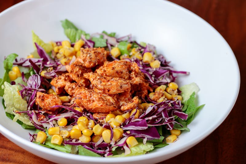 Colorful rainbow bowl filled with nutritious ingredients at Chopt